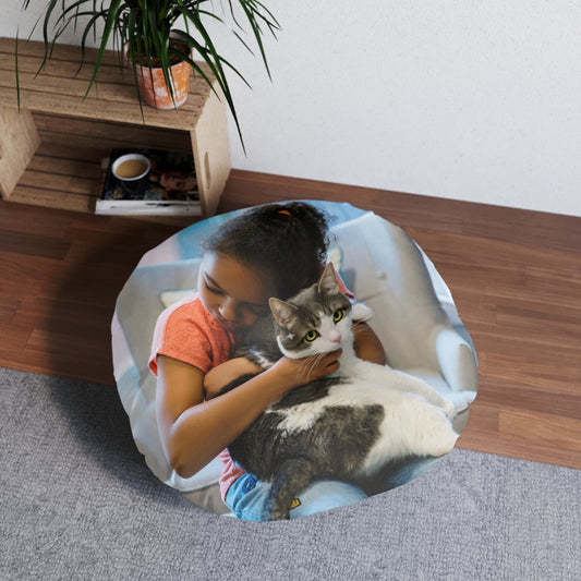Mockup of a round floor pillow showing a cute little girl holding a cat